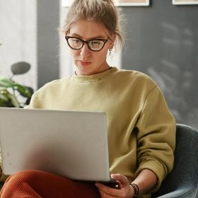 woman-watching-something-on-laptop-2021-11-08-16-18-34-utc-scaled